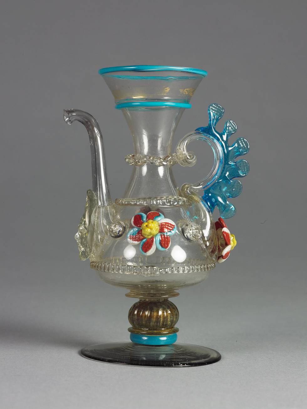 Photograph of a blue and yellow patterned Venetian glass vessel