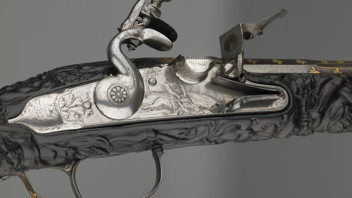 A detail of the firing mechanism of a flint-lock pistol