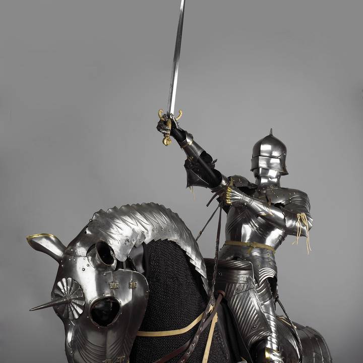 Photograph of a medieval knight on an armoured horse
