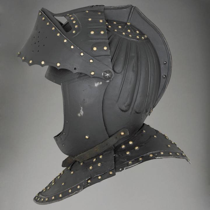 Side view of helmet with visor lifted that is blackened and painted