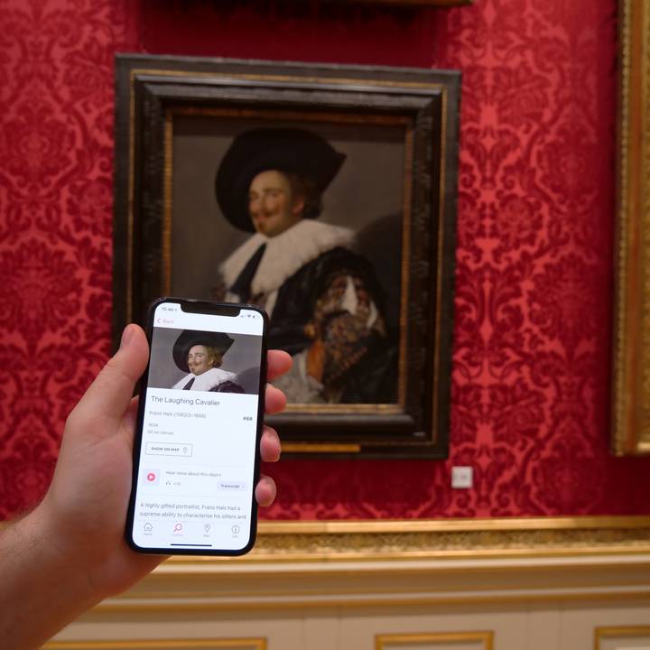A man using a mobile phone guide