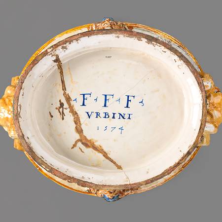 Artists initials and date painted on base of a ceramic wine cooler with crack and