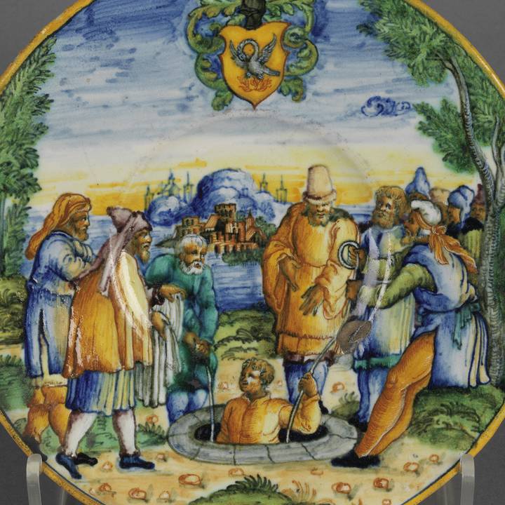 Plate with illustration of Joseph brothers lowering him into well