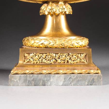 A detail of a porcelain vase mounted in gilt bronze