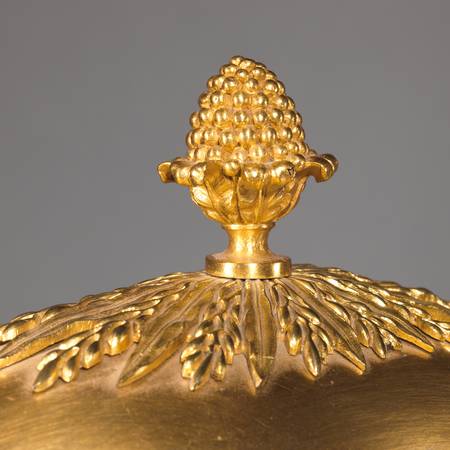 A detail of a porcelain vase mounted in gilt bronze