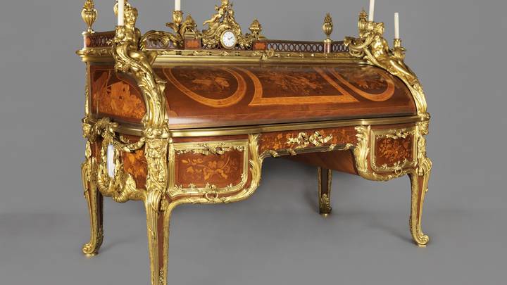 A marquetry roll-top desk