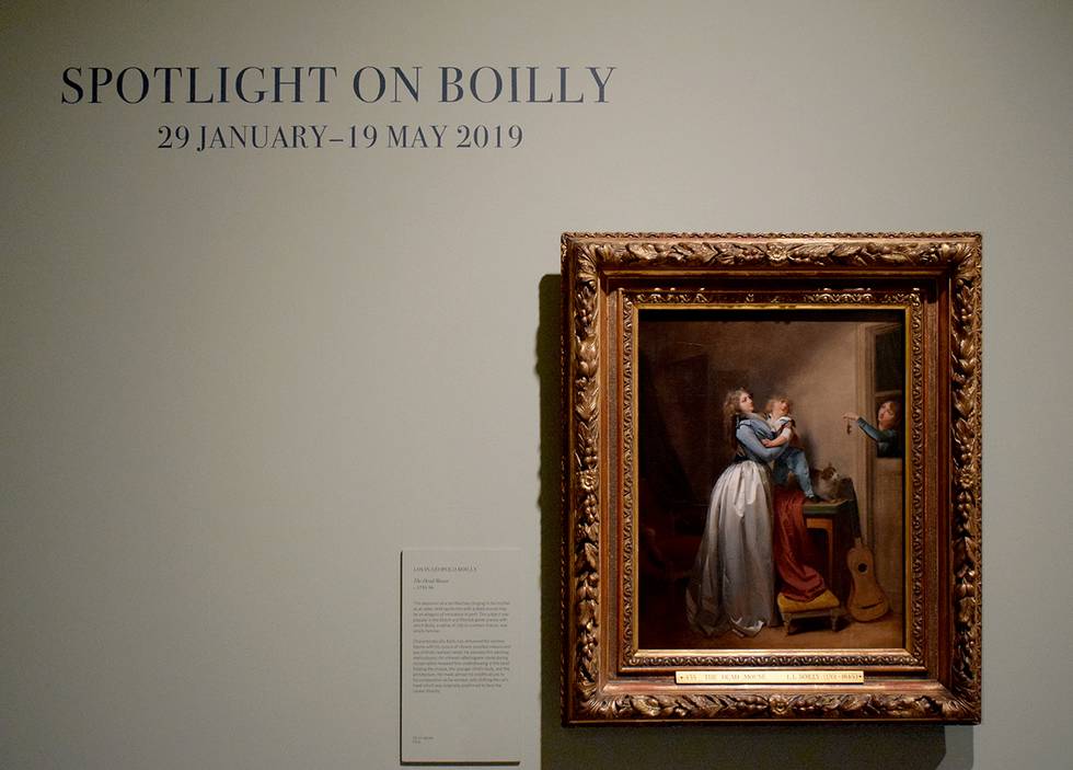 Painting hung on wall in exhibition