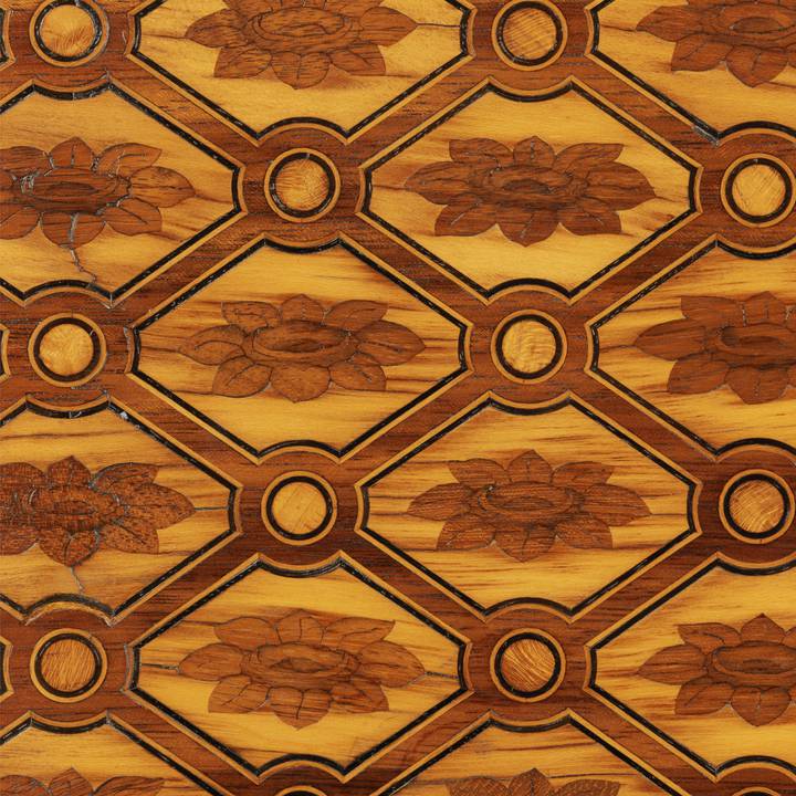 A detail of the trellis marquetry on a chest of drawers