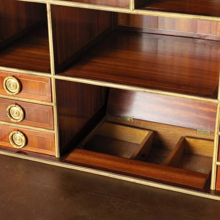 A detail of two secret drawers in a burr yew-veneered fall-front desk