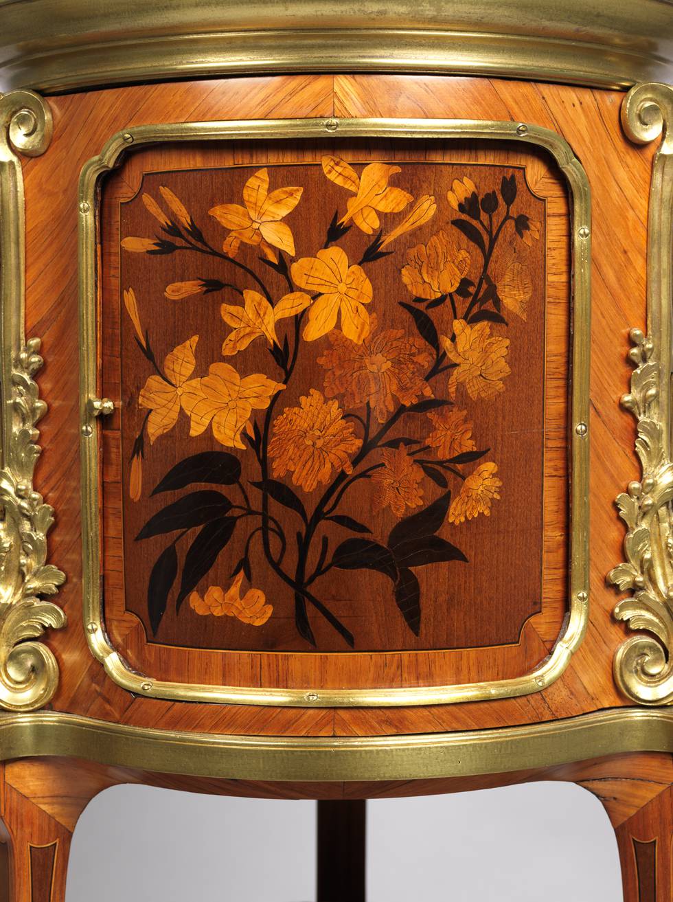A detail of marquetry flowers on a work table