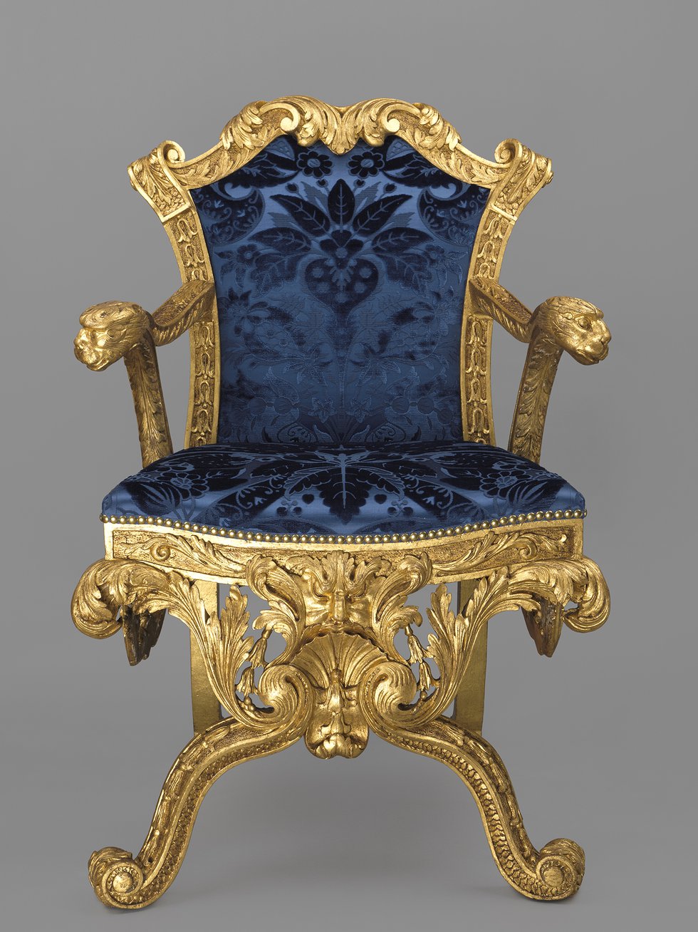 Oak carved and gilt armchair with blue silk velvet