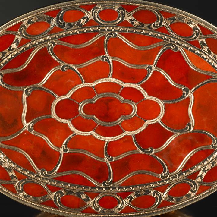 Detail of bottom view of orange hardstone and gold box