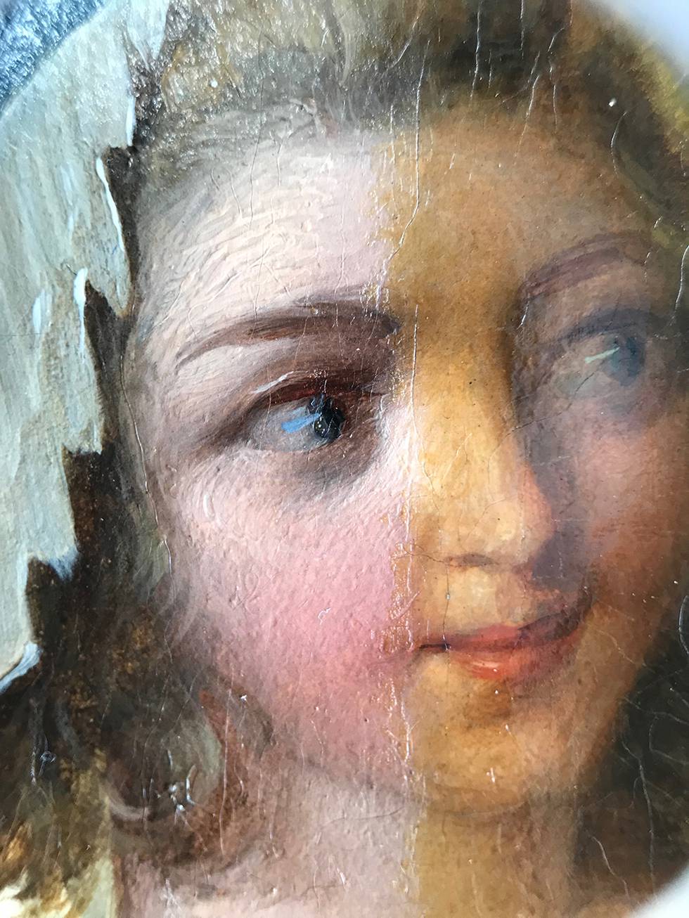 A detail of a painting depicting a woman