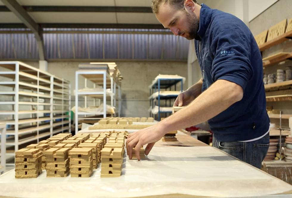 An image of a man in an artist's studio
