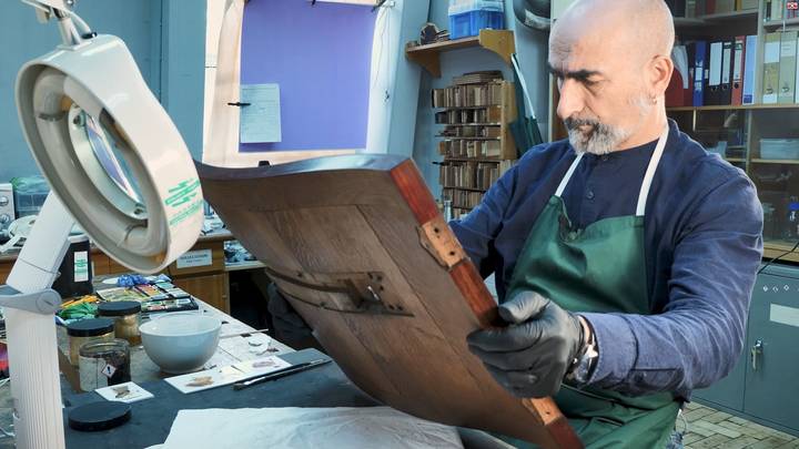 Jurgen looking at furniture in conservation