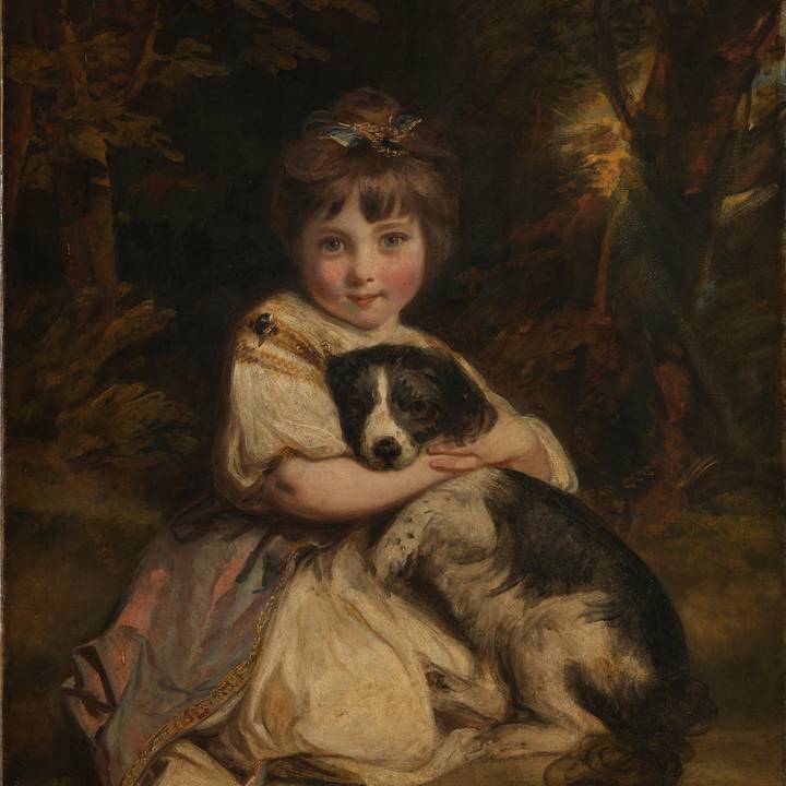 Portrait of  kneeling girl with dog