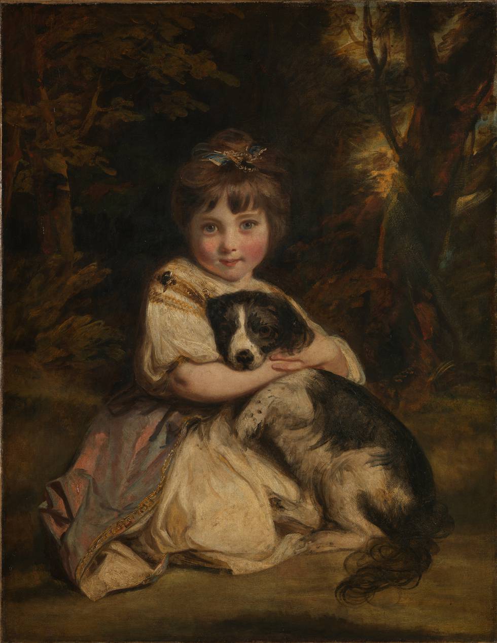 Portrait of  kneeling girl with dog