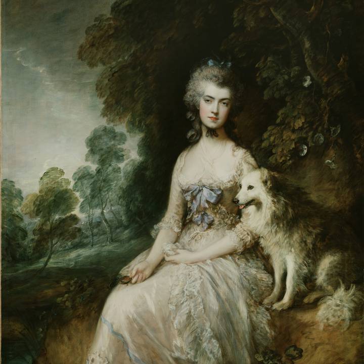 A portrait of a woman with a dog