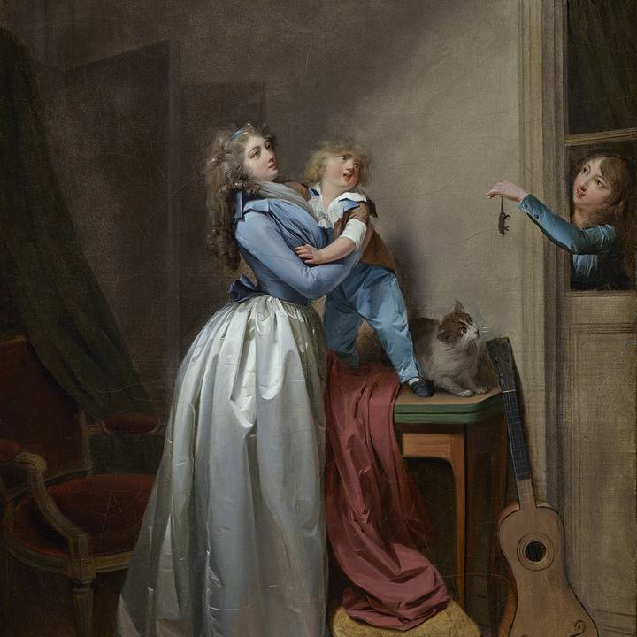 Women and child recoil from women holding mouse