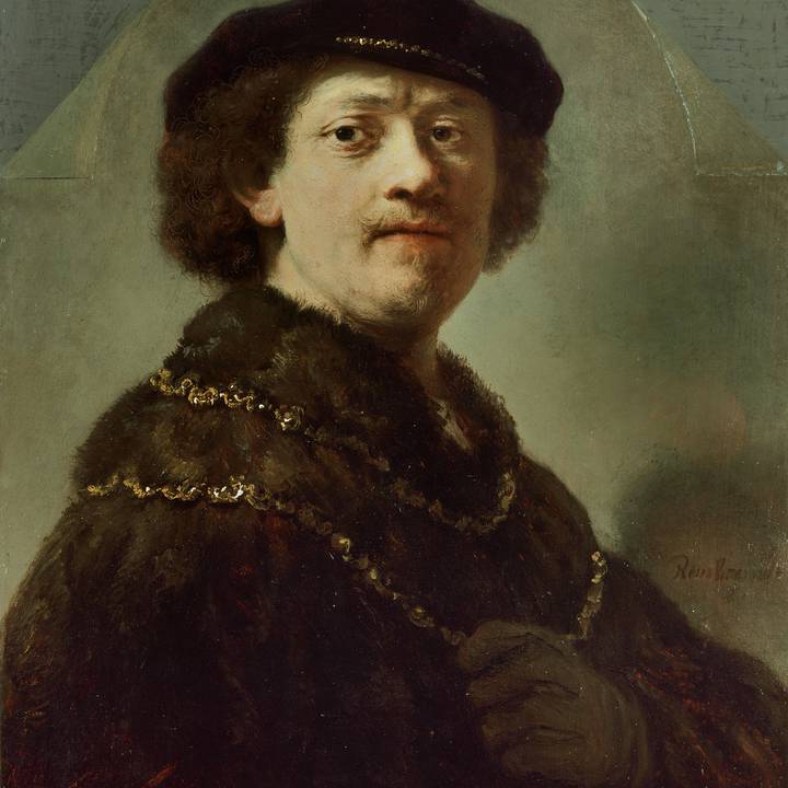 Full length portrait of young boy in costume holding baton