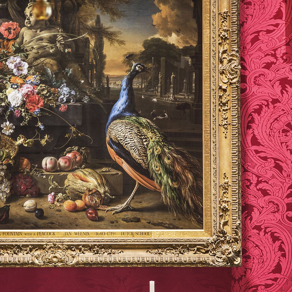 Bottom half of painting of flowers and peacock