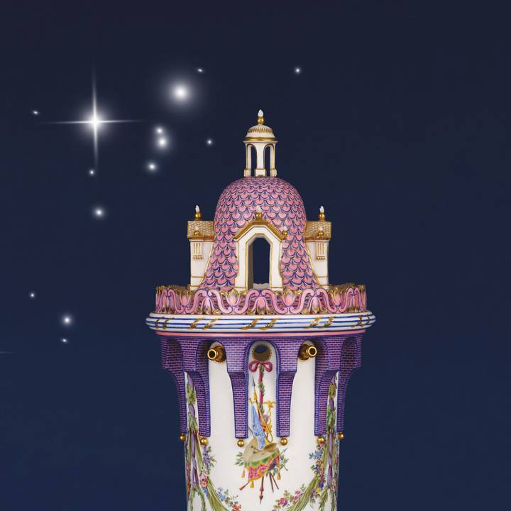 Pink and white castle on a dark blue background with sparkles