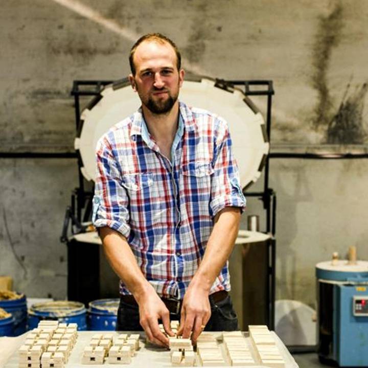 An image of a man in an artist's studio