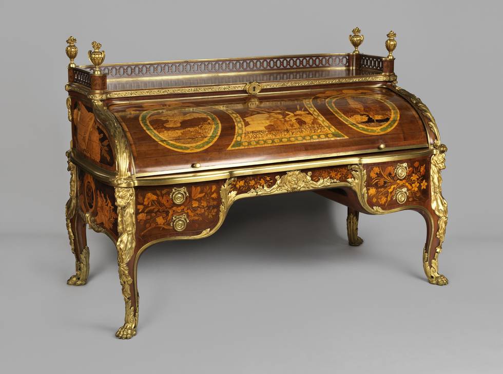 A marquetry roll-top desk